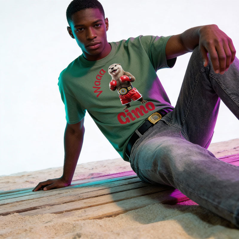 Young male wearing a green t-shirt with a graphic design Otter boxing on a wooden surface